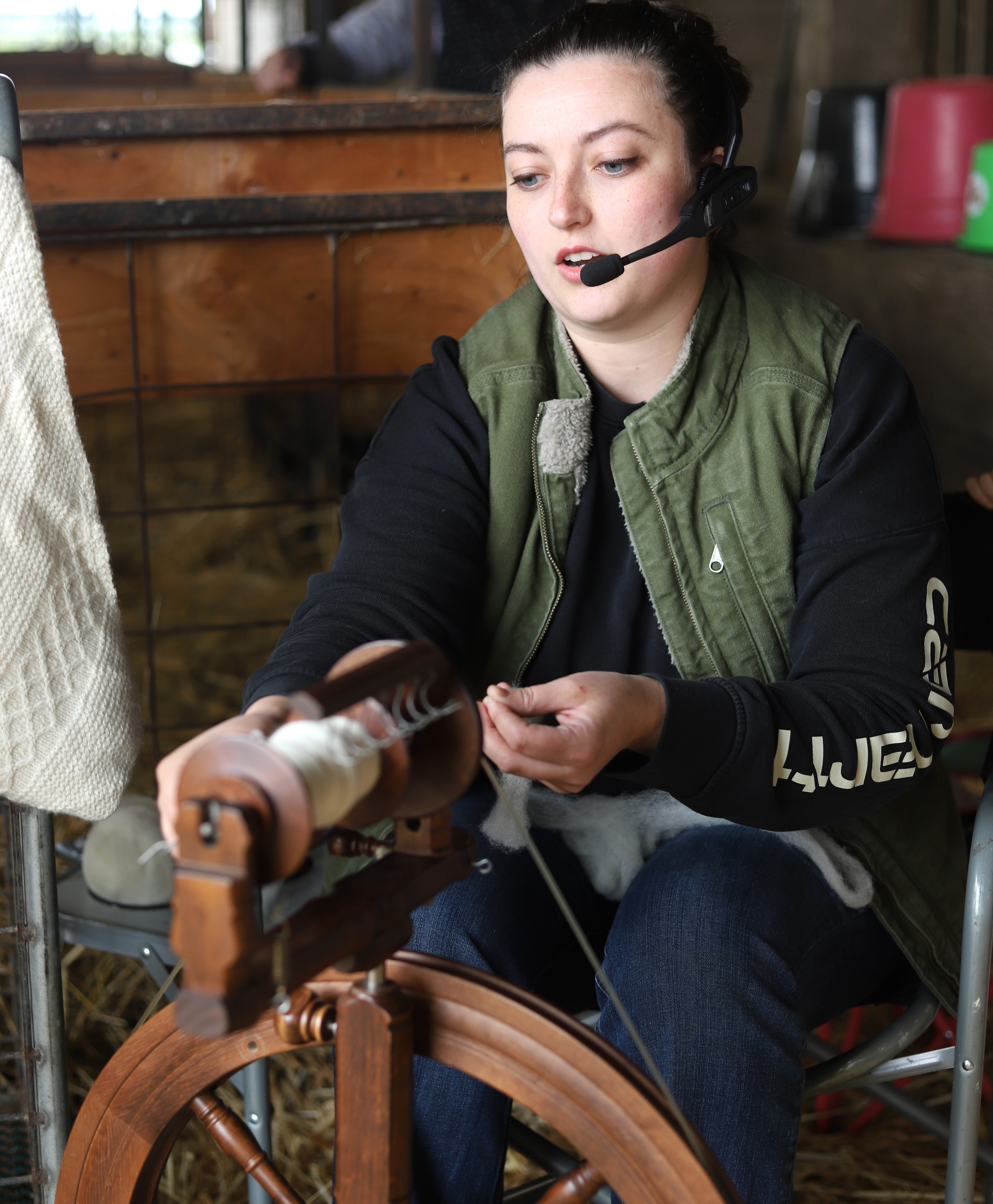 a woman spins wool