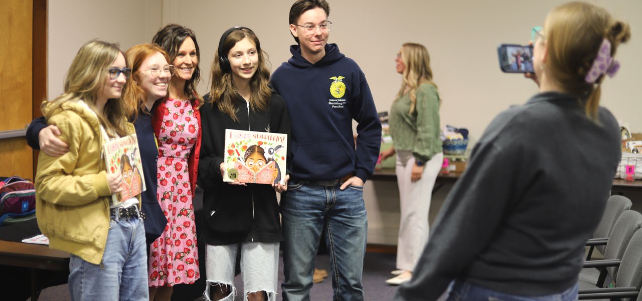 FFA members pose with author Shannon Anderson
