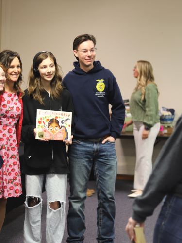 FFA members pose with author Shannon Anderson